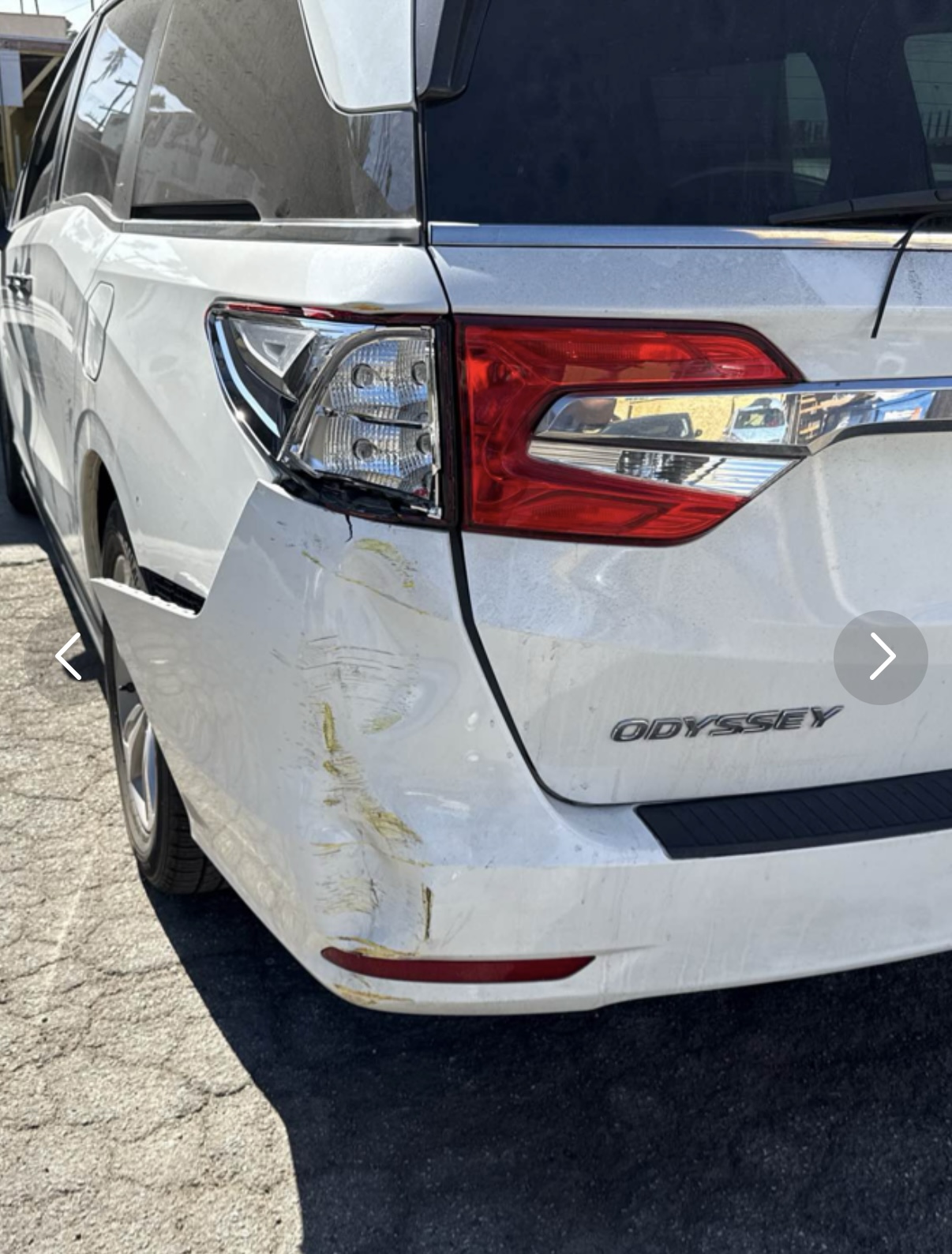 Before: white Honda Odyssey rear quarter panel and bumper repair