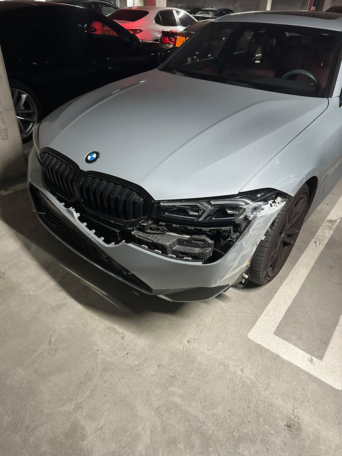 Before: gray BMW 330i front bumper and headlight collision repair